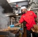 USS Carl Vinson Sailor Prepares Food in the Galley