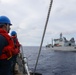 Sailors aboard the USS Howard conduct a replenishment-at-sea with the HMNZS Aotearoa in the South China Sea