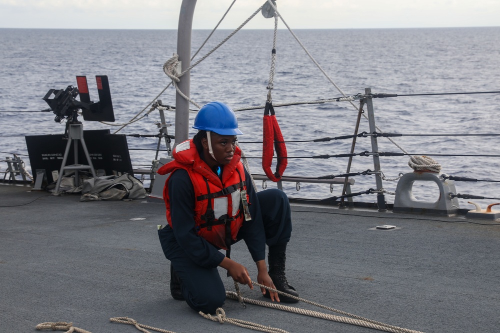 Sailors aboard the USS Howard conduct a replenishment-at-sea with the HMNZS Aotearoa in the South China Sea