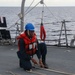 Sailors aboard the USS Howard conduct a replenishment-at-sea with the HMNZS Aotearoa in the South China Sea