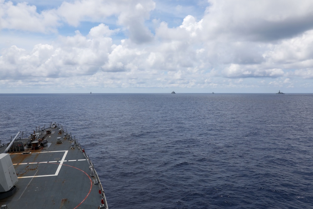 The USS Howard conducts a maneuvering exercise with ships from the Royal New Zealand Navy, the Royal Australian Navy, the Armed Forces of the Philippines Navy and the Japan Maritime Self-Defense Force in the South China Sea