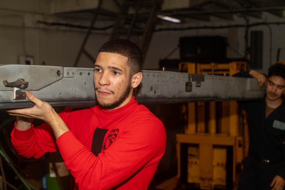 Moving Ordnance Equipment Aboard Theodore Roosevelt