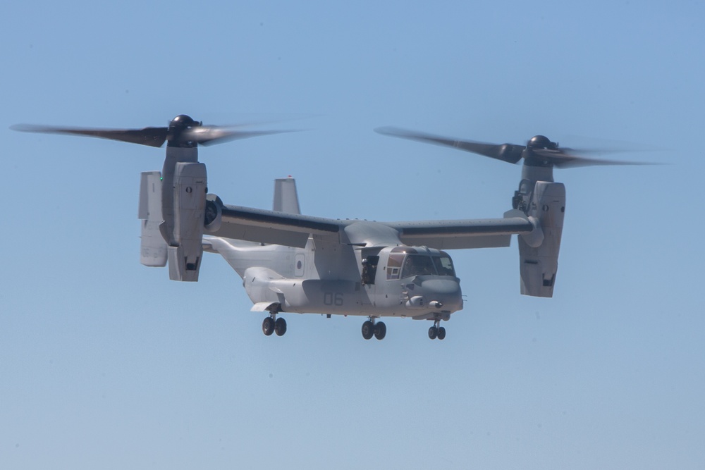 A US Marine Corps MV-22B Osprey tiltrotor aircraft performs a flight demonstration with rotors in transition at the 2024 Miramar Airshow