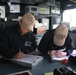 Quartermasters stand watch aboard USS Lake Erie (CG 70) in the Northern Pacific Ocean