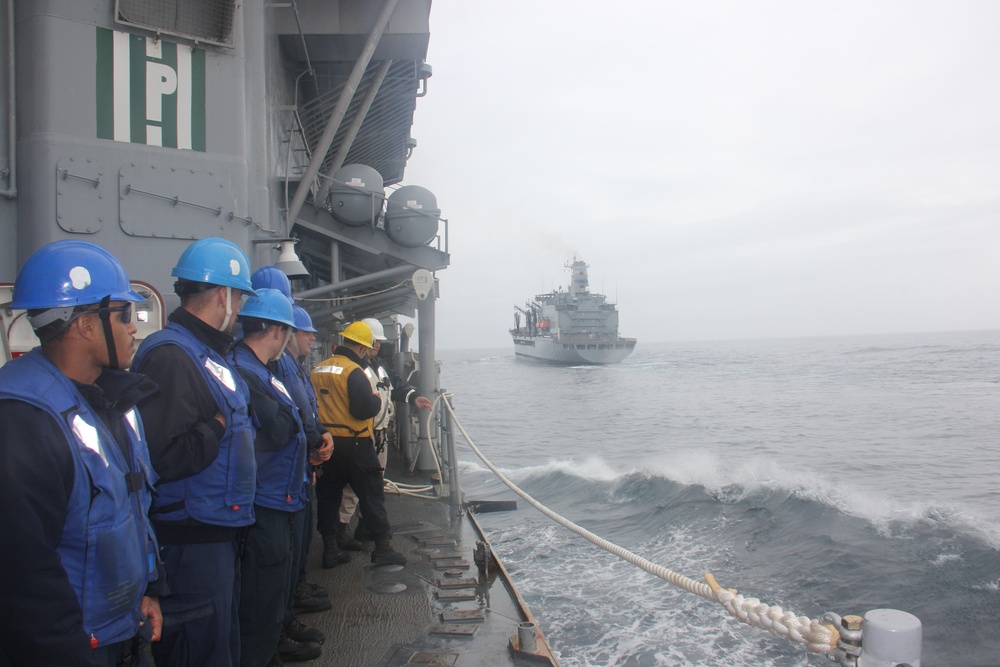 USS Lake Erie (CG 70) conducts replenishment at sea in the Northern Pacific Ocean
