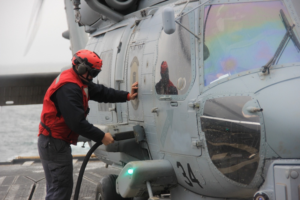 USS Lake Erie (CG 70) conducts replenishment at sea in the Northern Pacific Ocean