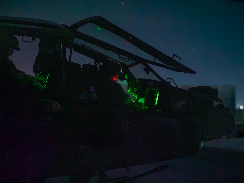 10th Combat Aviation Brigade AH-64 Apache Pilots Conduct Pre-flight Checks at Night