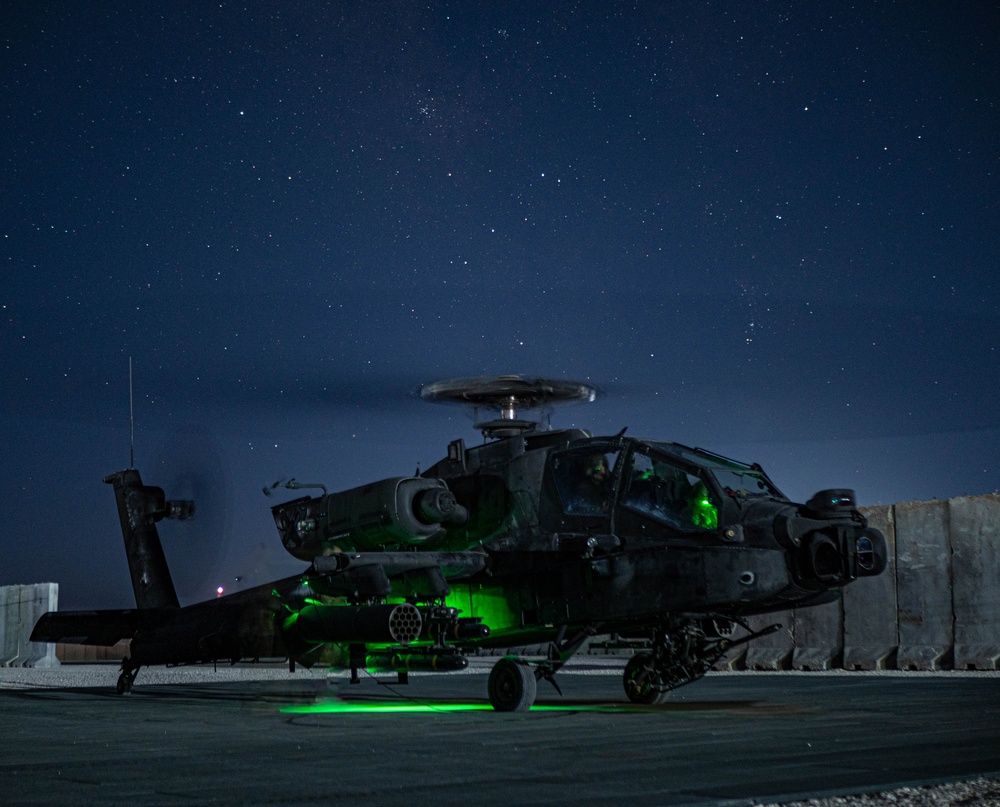 10th Combat Aviation Brigade AH-64 Apache Pilots Conduct Pre-flight Checks at Night