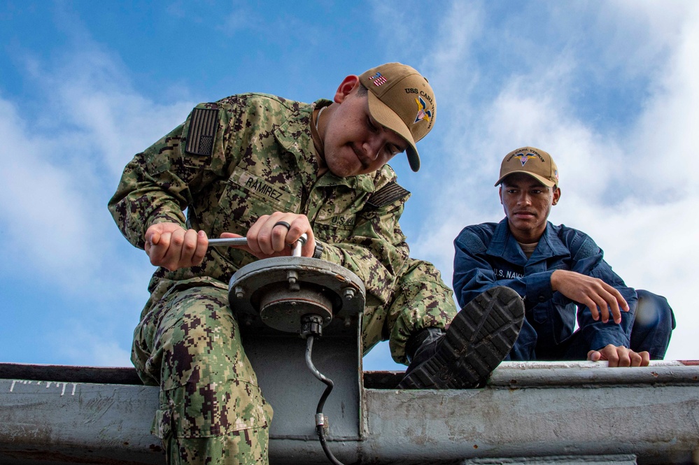 Sailors Replace Deck Edge Lights Aboard USS Carl Vinson (CVN 70)