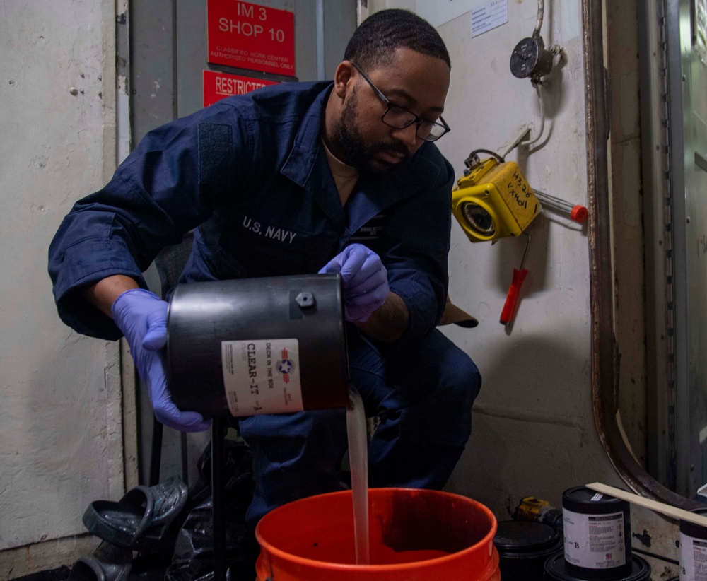 Sailor Prepares Epoxy Aboard USS Carl Vinson (CVN 70)