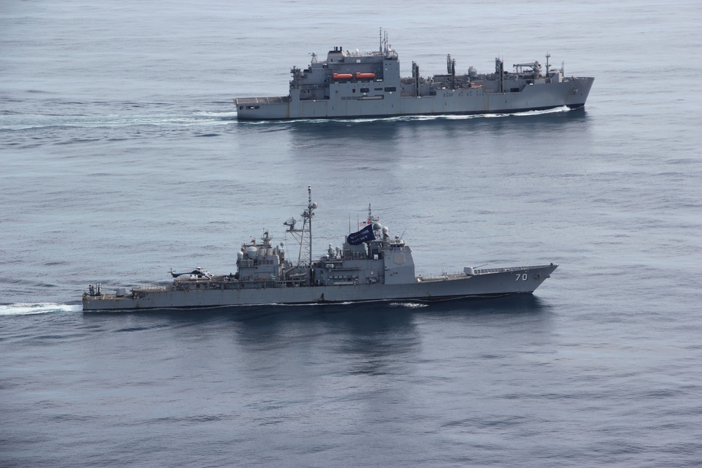 USS Lake Erie (CG 70) operates with USNS Yukon (T-AO 202) in the Northern Pacific Ocean