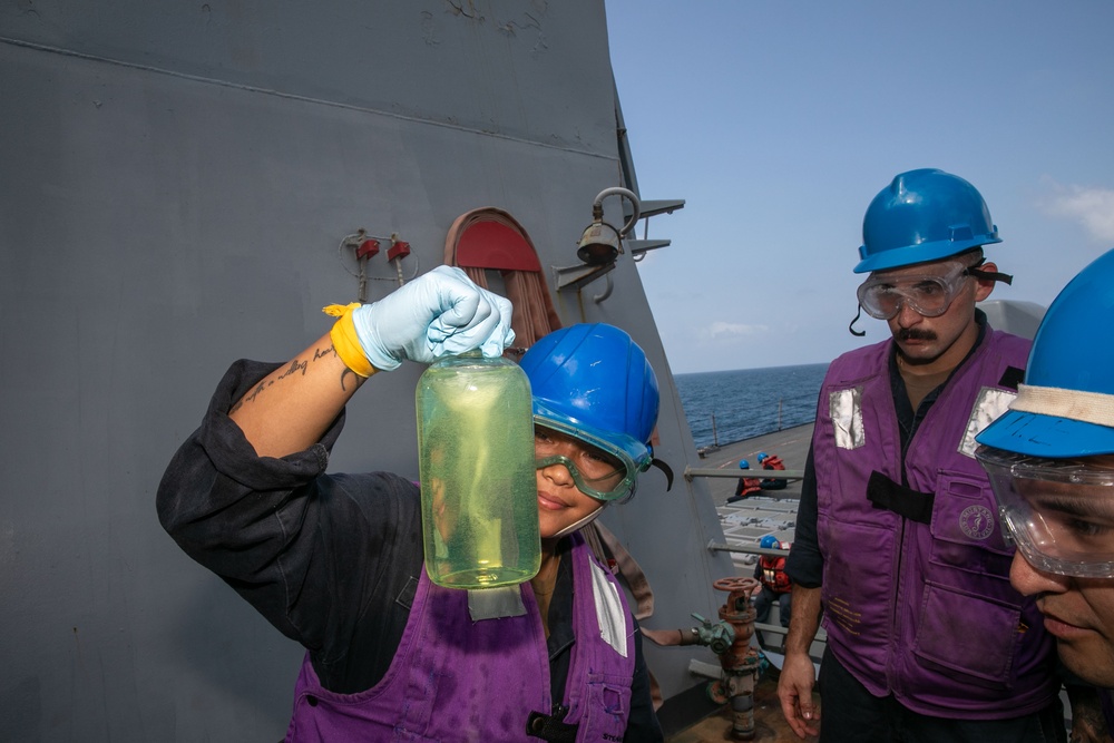 O’Kane Sailors inspect fuel during refueling-at-sea