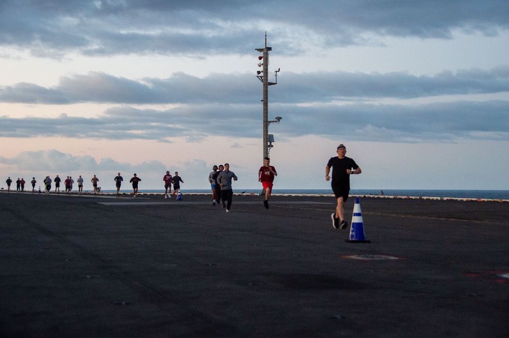 USS Ronald Reagan (CVN 76) Sailors participate in a flight deck run