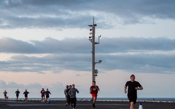 USS Ronald Reagan (CVN 76) Sailors participate in a flight deck run