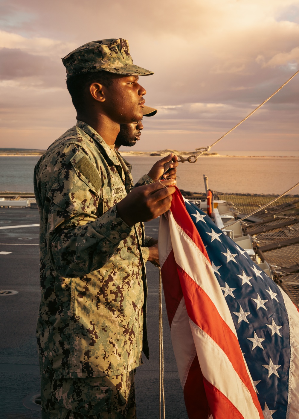 USS Richard M. McCool, Jr. (LPD 29) Participates in Morning Colors