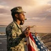 USS Richard M. McCool, Jr. (LPD 29) Participates in Morning Colors