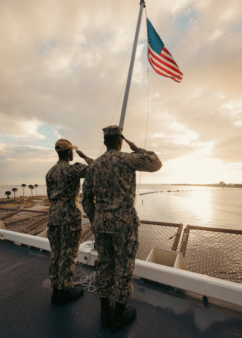 USS Richard M. McCool, Jr. (LPD 29) Participates in Morning Colors