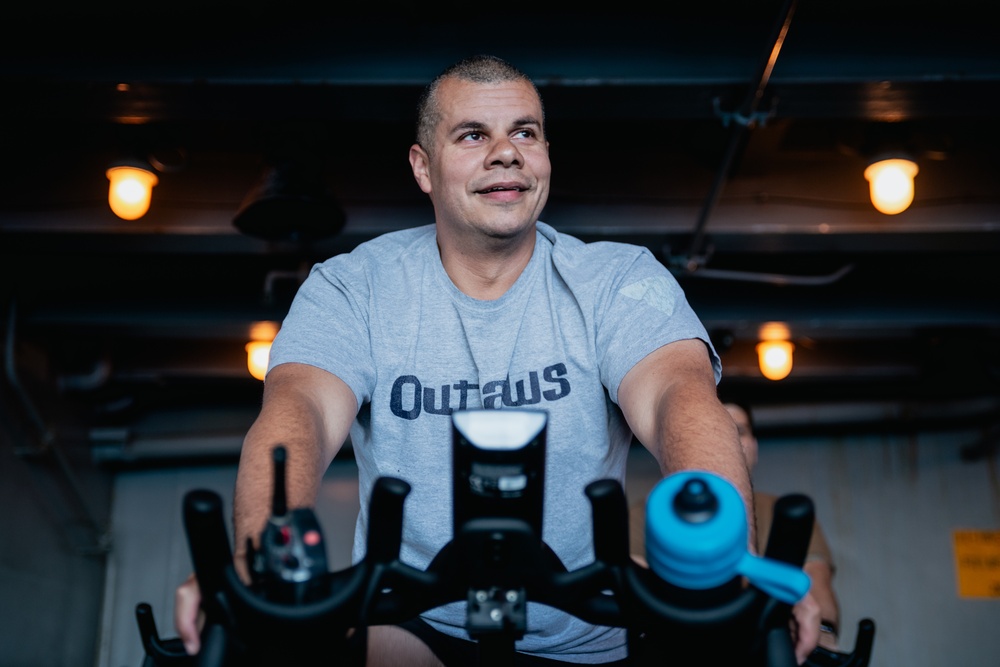 USS Ronald Reagan (CVN 76) Sailors attend a spin class