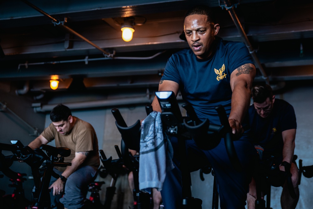 USS Ronald Reagan (CVN 76) Sailors attend a spin class