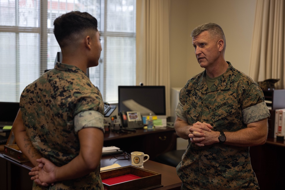 Brigadier General Collins Congratulates Marine of the Quarter