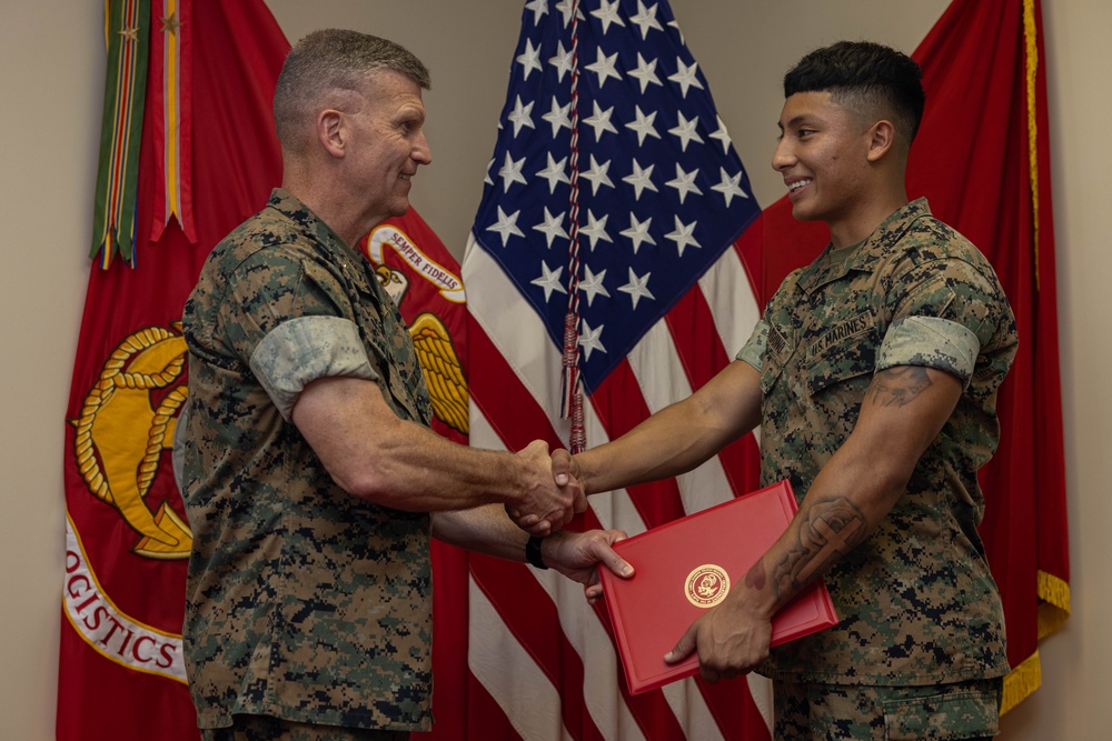 Brigadier General Collins Congratulates Marine of the Quarter