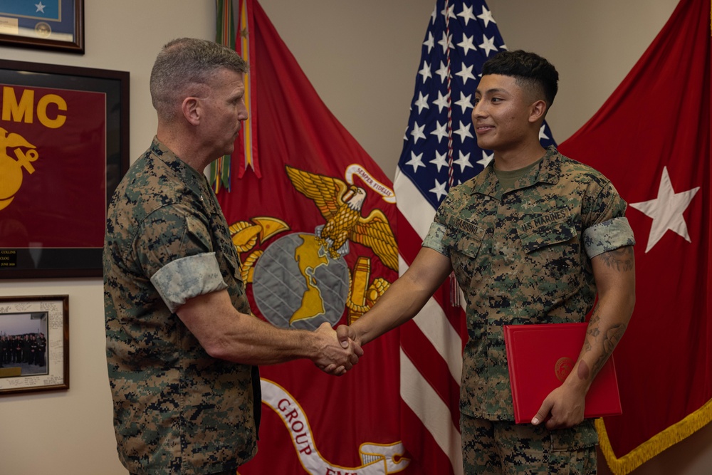 Brigadier General Collins Congratulates Marine of the Quarter