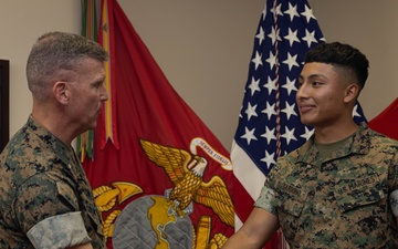 Brigadier General Collins Congratulates Marine of the Quarter