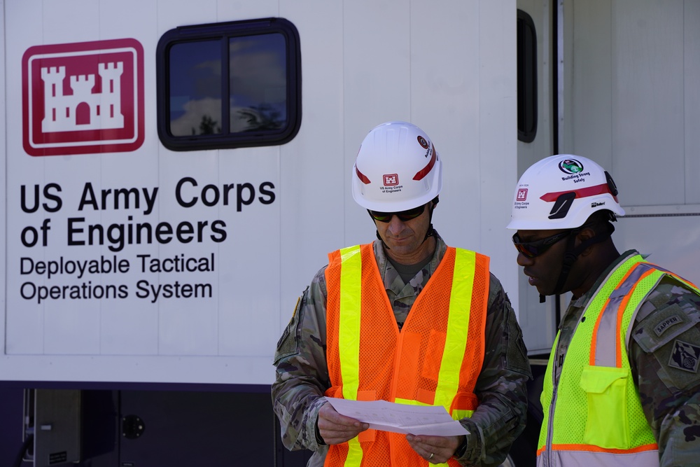 USACE Wilmington District Commander, Col. Brad Morgan visits the Generator Staging Base in Charlotte, NC. Pictured with Power Mission Commander CPT Walter Dezir.