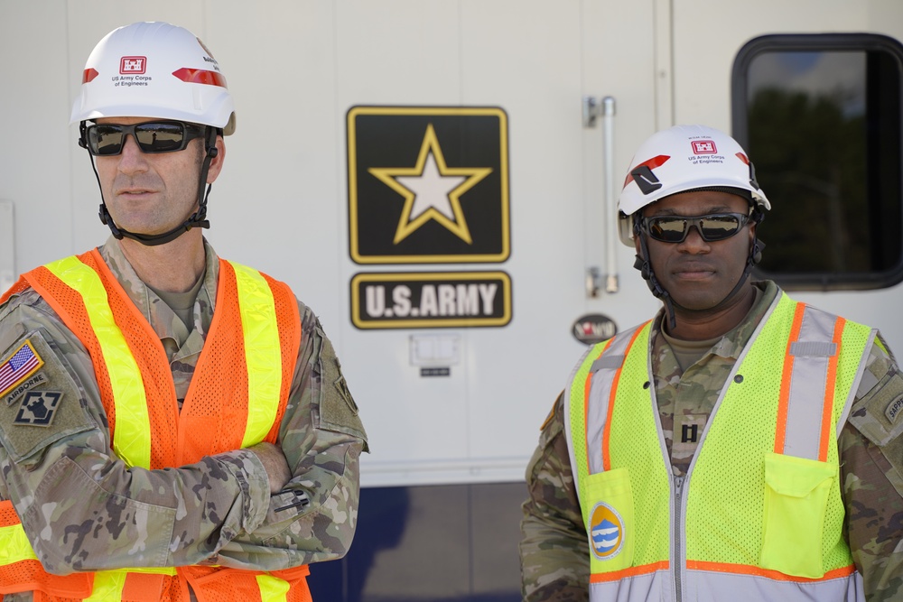USACE Wilmington District Commander, Col. Brad Morgan (left) visits the Generator Staging Base in Charlotte, NC. Pictured with Power Mission Commander CPT Walter Dezir (right)..