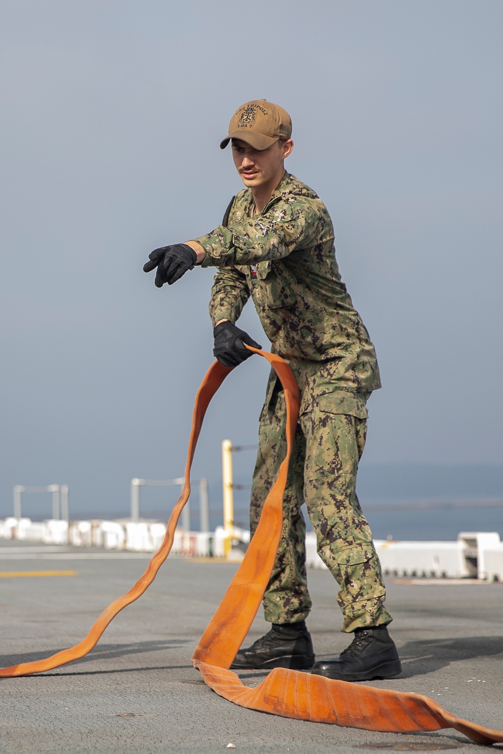 Tripoli Sailors Bring Ammo Onboard