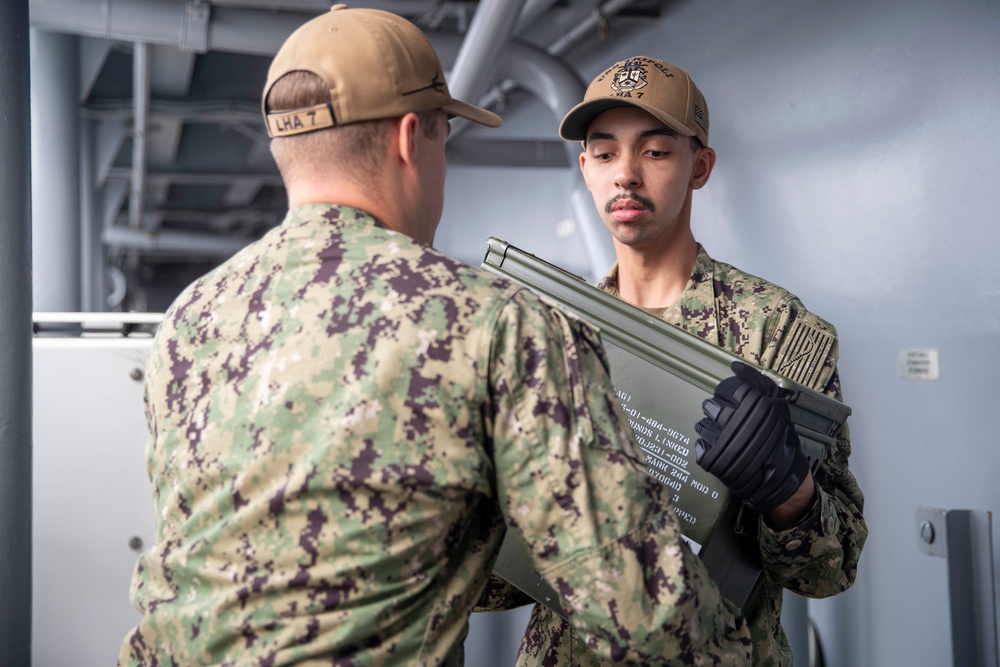 Tripoli Sailors Bring Ammo Onboard