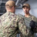 Tripoli Sailors Bring Ammo Onboard