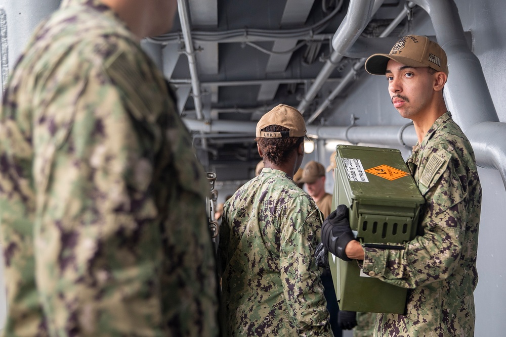 Tripoli Sailors Bring Ammo Onboard