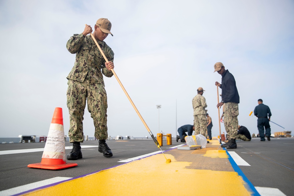 Tripoli Sailors Bring Ammo Onboard