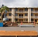 Out With The Old, In With The New: Construction workers prepare to demolish the Mackie Hall barracks