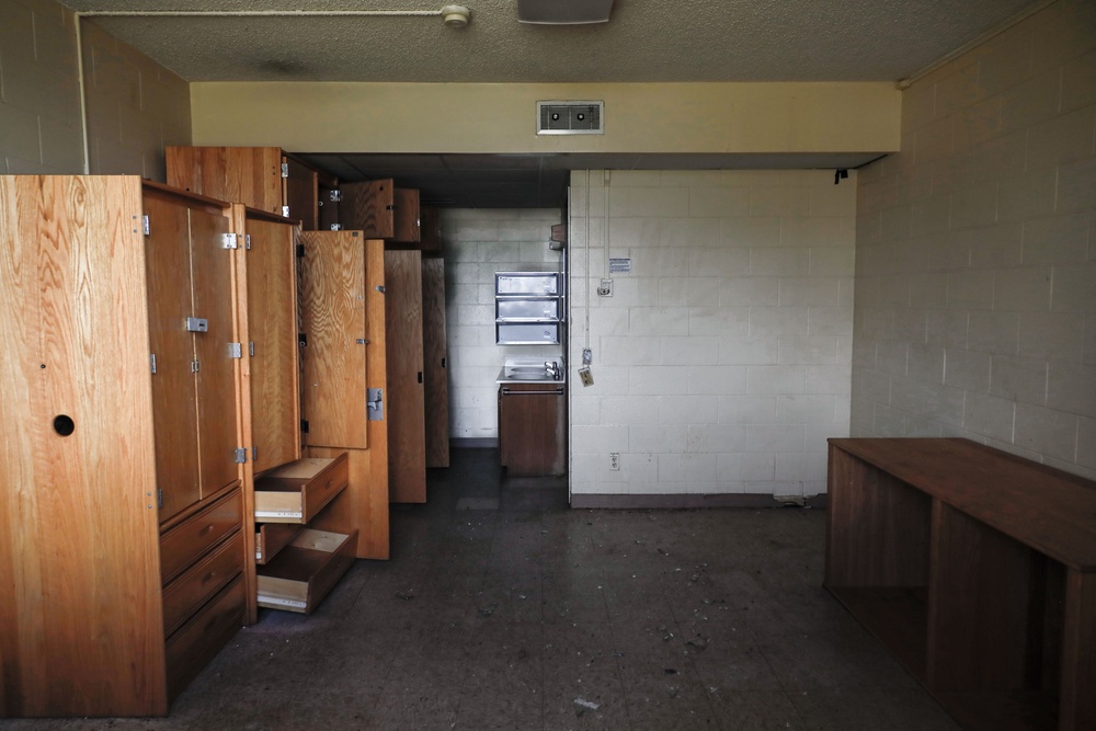 Out With The Old, In With The New: Construction workers prepare to demolish the Mackie Hall barracks