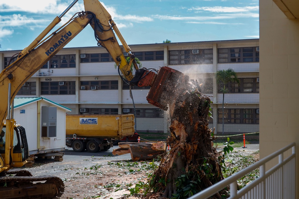 Out With The Old, In With The New: Construction workers prepare to demolish the Mackie Hall barracks