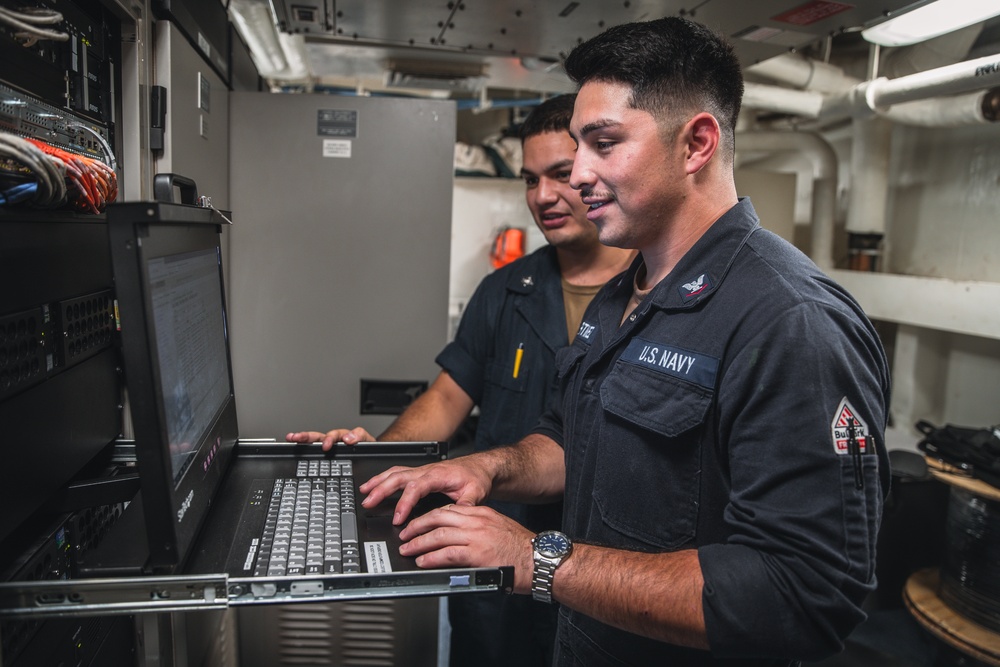 USS George Washington Sailors troubleshoot equipment