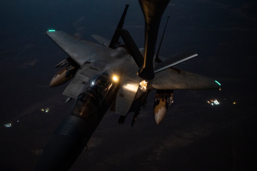 KC-135 Stratotanker refuels F-15E Strike Eagles