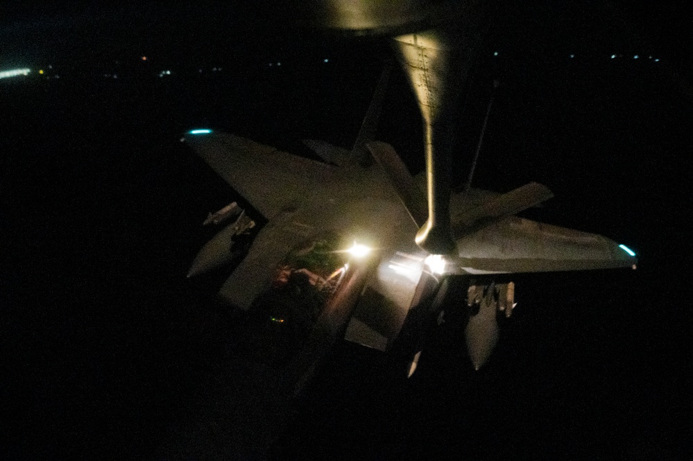 KC-135 refuels F-15Es at night