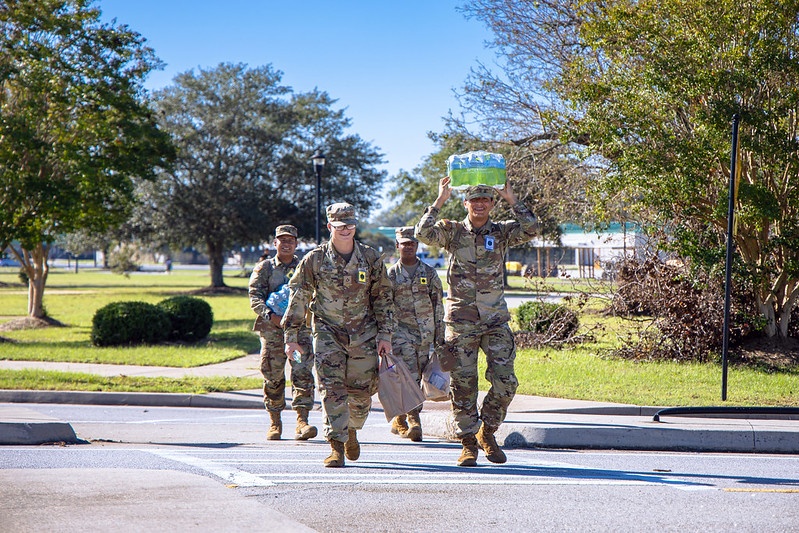 Soldiers Walk to the Barracks after Shopping