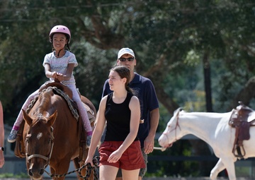 Families harness resilience at therapeutic horse event