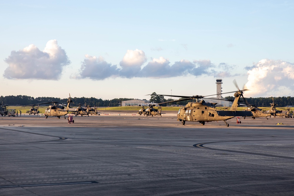 U.S. Army UH-60 Black Hawks are staged for deployment at Fort Liberty