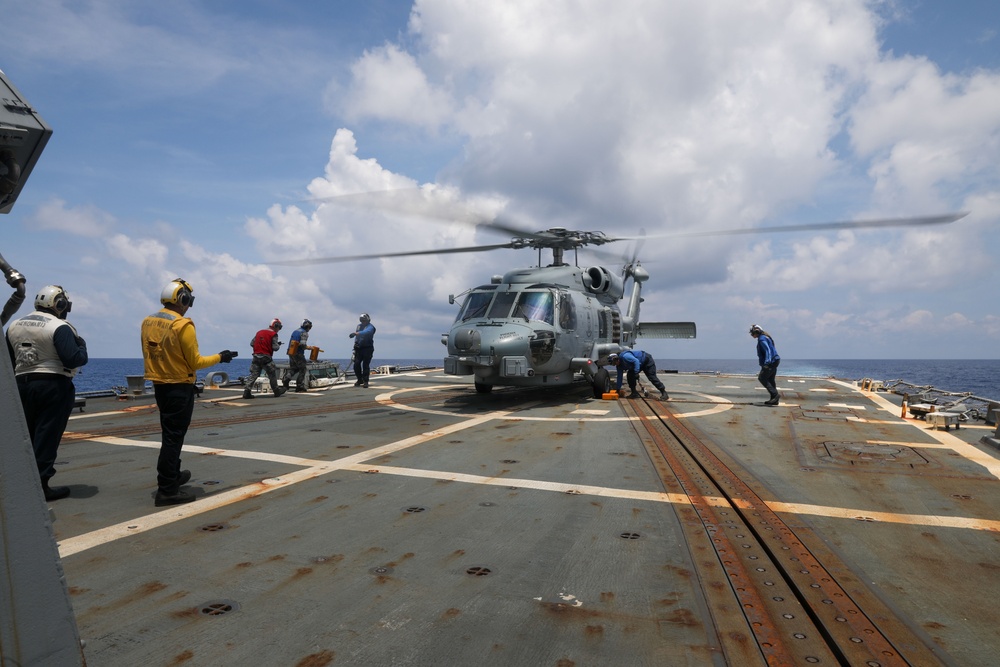 Sailors aboard the USS Howard conduct a passenger transfer with Sailors aboard the HMAS Sydney V in the South China Sea