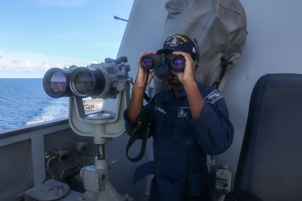 Sailors aboard the USS Howard stand watch in the South China Sea