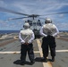 Sailors aboard the USS Howard conduct flight quarters with an MH-60R Sea Hawk helicopter as part of an exercise with the HMAS Sydney V in the South China Sea