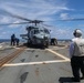 Sailors aboard the USS Howard conduct flight quarters with an MH-60R Sea Hawk helicopter as part of an exercise with the HMAS Sydney V in the South China Sea