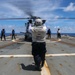 Sailors aboard the USS Howard conduct flight quarters with an MH-60R Sea Hawk helicopter as part of an exercise with the HMAS Sydney V in the South China Sea