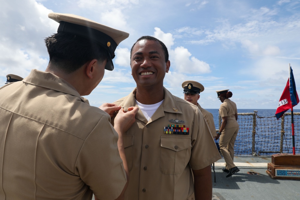 Sailors aboard the USS Howard conduct a Chief Petty Officer Pinning Ceremony in the South China Sea