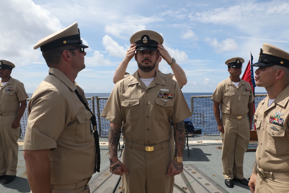 Sailors aboard the USS Howard conduct a Chief Petty Officer Pinning Ceremony in the South China Sea